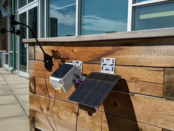 A solar-powered methane monitoring unit installed outdoors